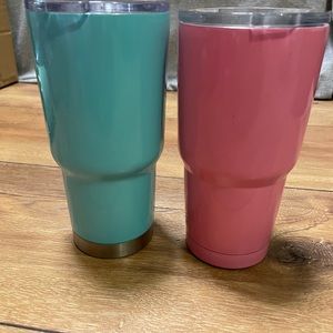 2 Insulated 20 oz. Tumblers RTIC and the other is a no name brand